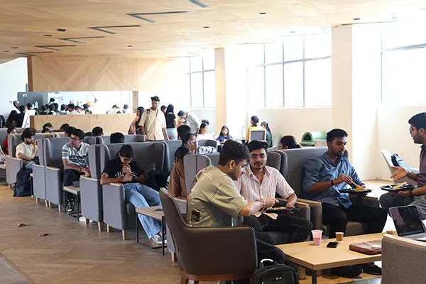 Students at tables in the food court
