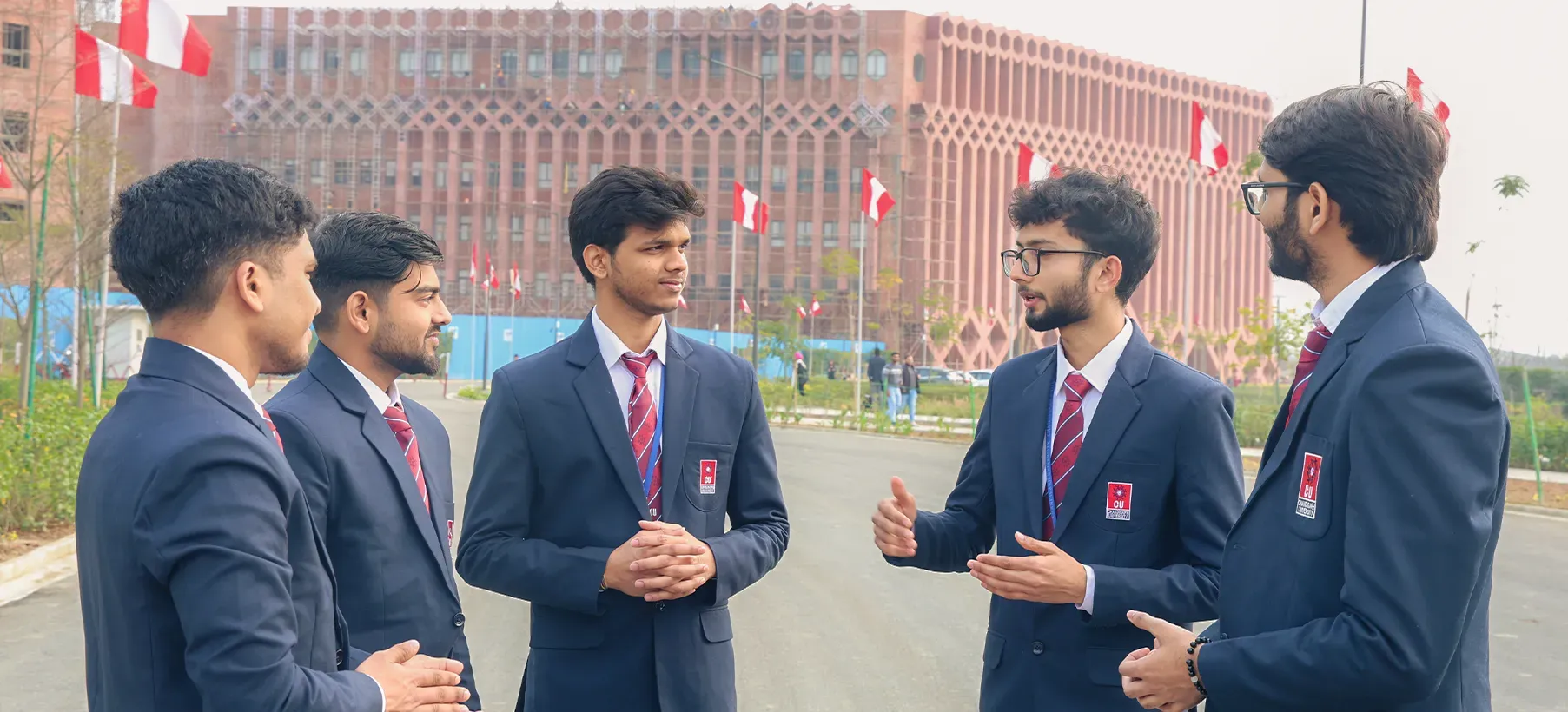Students talking together outside the academic block
